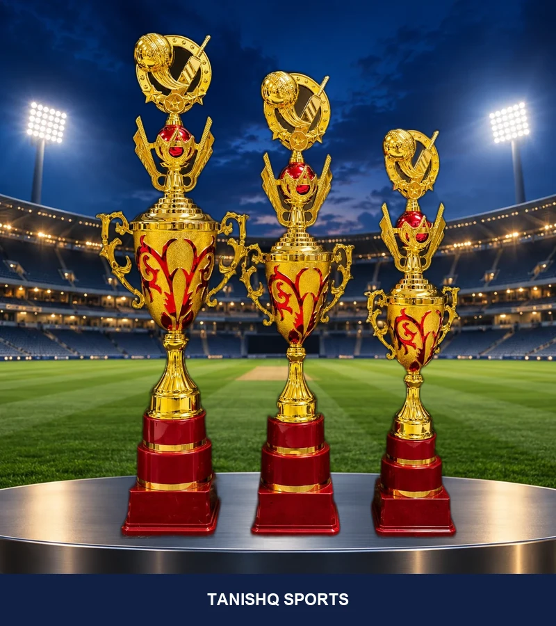 Three golden cricket champion trophies with ruby red bases